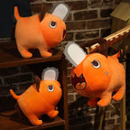 Chainsaw Pup Vibes plush keychain – Shonen Realm Apparel - Three orange plush toys with chainsaws for heads 