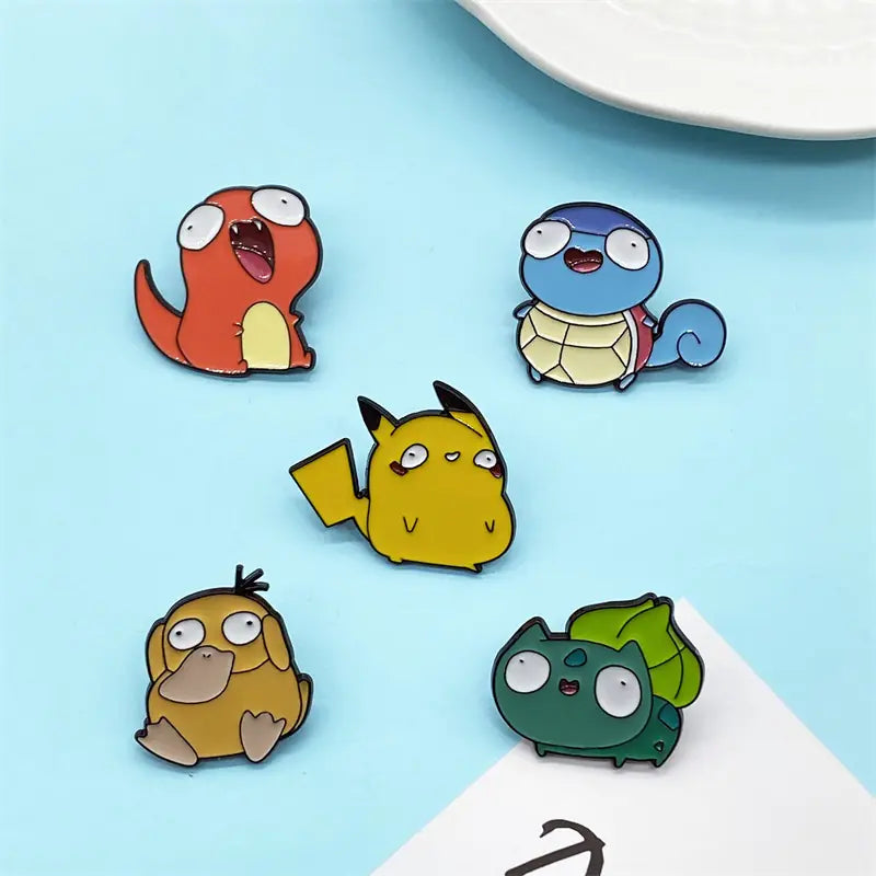 Mini Anime Brooch Pins Close-up of enamel finish on Shonen Realm Apparel brooch Five cartoon character pins 