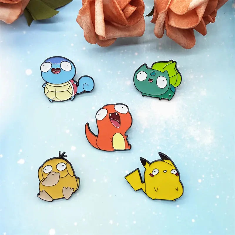 Mini Anime Brooch Pins Cute Pokémon enamel pin by Shonen Realm Apparel Five cartoon-style character pins on a light blue 