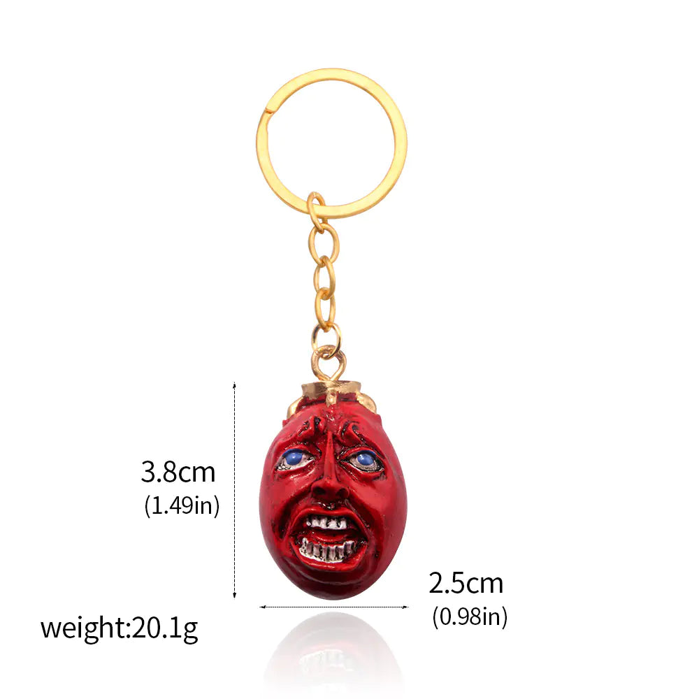 Windblade Pendant - Keychain with a red face design and gold chain