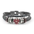 Uzumaki x Luffy x Levi Wrap Levi tribute wristband on display - Black braided leather bracelet with metal and wooden beads 